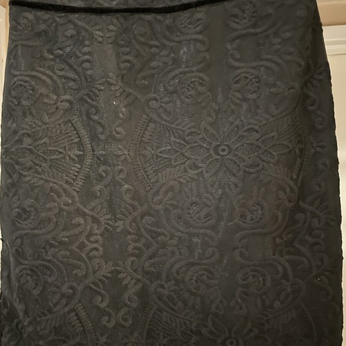 Zinas black mini pencil skirt made of embossed brocade fabric