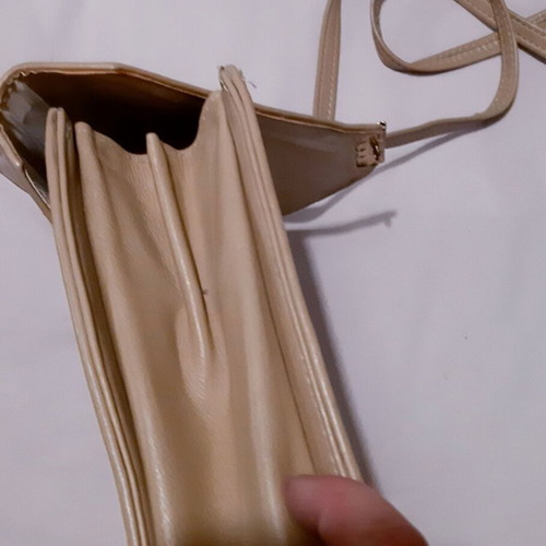 Handbag beige genuine leather used with metal details and lock