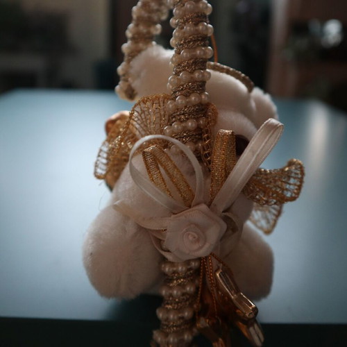 Christmas teddy bear like new with golden caramel and feathers