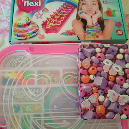 Bracelet making set used with beads and tools, includes Lego bracelet