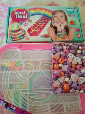 Bracelet making set used with beads and tools, includes Lego bracelet