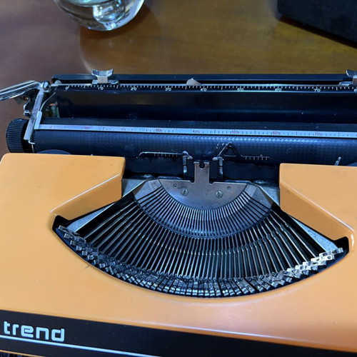 Vintage Trend Typewriter used with ribbon and case, orange color