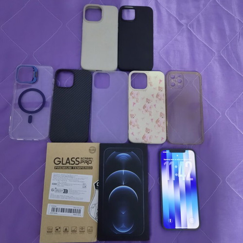 iPhone 12 Pro Max Pacific Blue 128GB like new with 7 cases and screen protectors