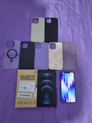 iPhone 12 Pro Max Pacific Blue 128GB like new with 7 cases and screen protectors