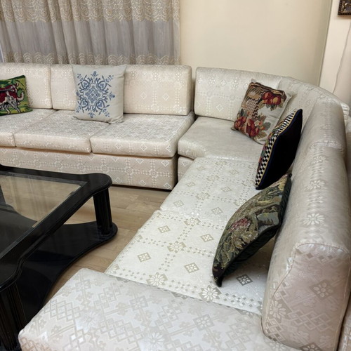 Sectional living room set used, three pieces with central and side tables