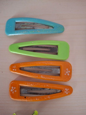Hair clips used, 2 sets with orange, green and blue colors