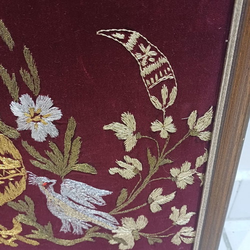 Embroidered textile painting used with gold thread on velvet