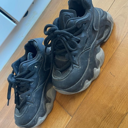Athletic shoes used with thick sole and laces black with gray