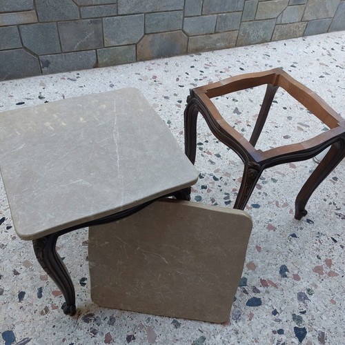 Vintage side tables pair with natural marble used