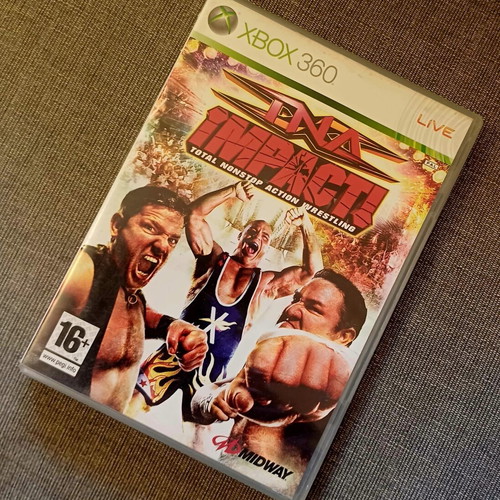 TNA Impact Xbox 360 game used with bonus DVD and collectible double-sided cover