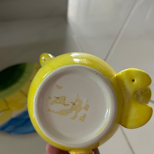 Vintage ceramic children's mug with turtle design used