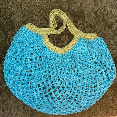 Handmade mesh market bag blue with green handles, made of cotton