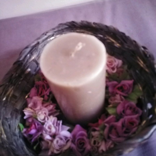 Decorative basket used with candle and floral wreath