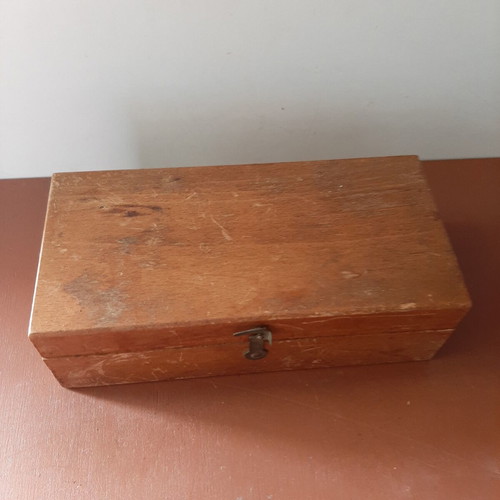 Wooden collectible box with cast iron weights