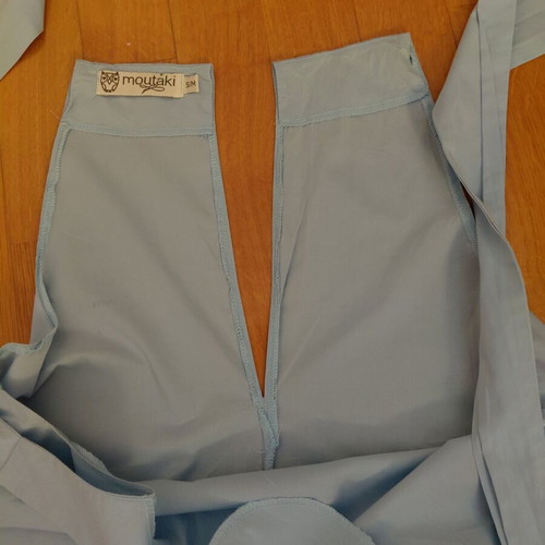 Moutaki top like new, blue with back opening and neck tie