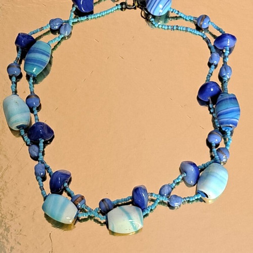 Long necklace like new with blue and purple glass and ceramic stones