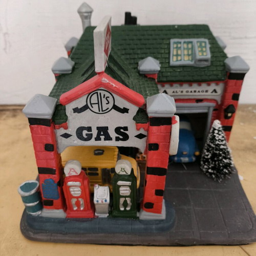 Decorative gas station like new with vehicles