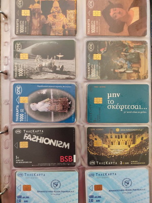 Collection of 250 used phone cards in album