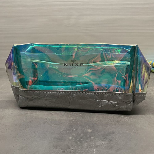Nuxe holographic makeup bag with silver base