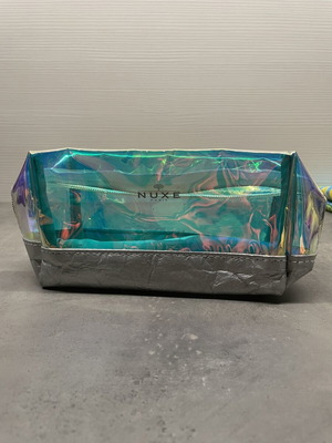 Nuxe holographic makeup bag with silver base