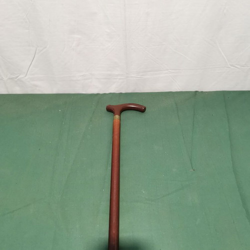 Wooden walking cane used, dark brown color