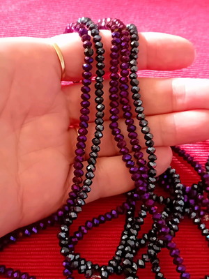 Package. Two long necklaces, in two shades.