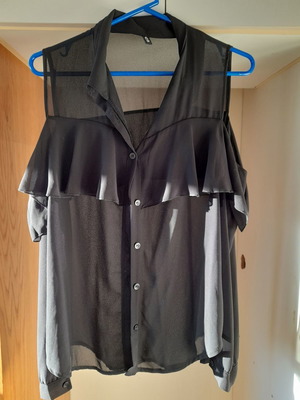 Black see thru sleeveless blouse with ruffles on chest, size L