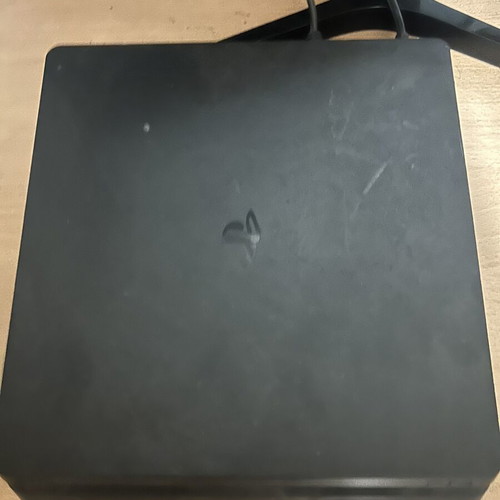 PlayStation 4 console with controller and Minecraft game, 500GB