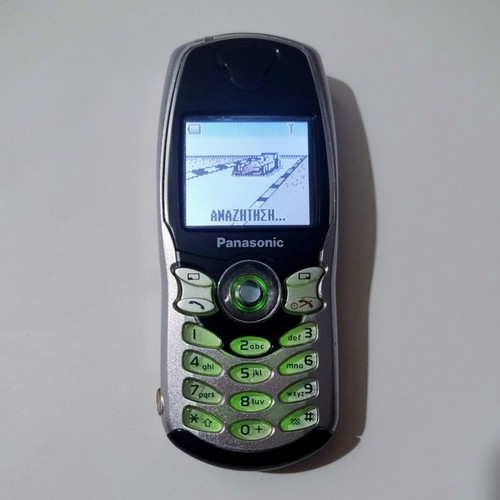 Panasonic EB-GD67 vintage cell phone used, silver, functional with charger