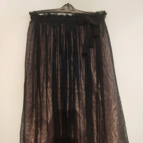 Skirt used with tulle on satin salmon base and black polka dots