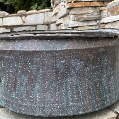 Vintage copper cauldron with hand-forged decoration used
