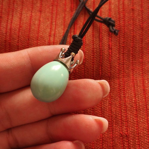 Handmade necklace with crown pendant and teardrop stone, used