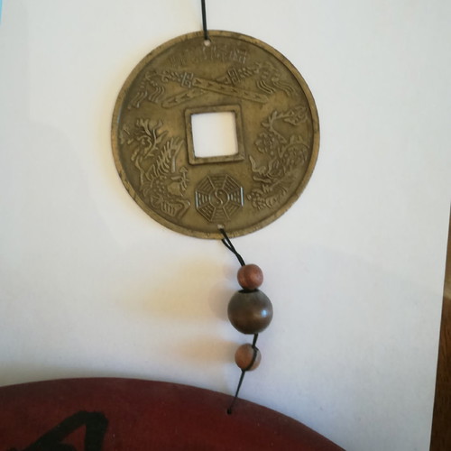 Melodos made of wood and metal with painted ideograms and Chinese zodiac new