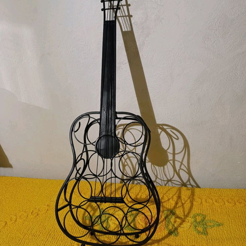 Metal guitar stand used for bottles vintage