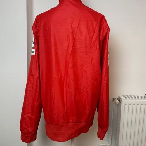 Ducati team jacket used, moderate condition with holes and stains