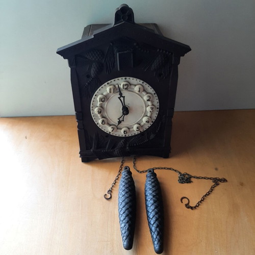 Vintage cuckoo clock used with pinecone weights