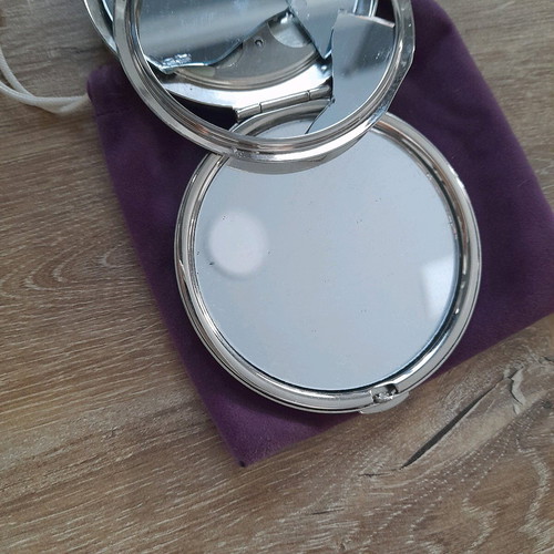 Compact mirror for bag used with purple velvet pouch