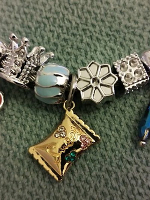 Steel bracelet with charms like new, silver color