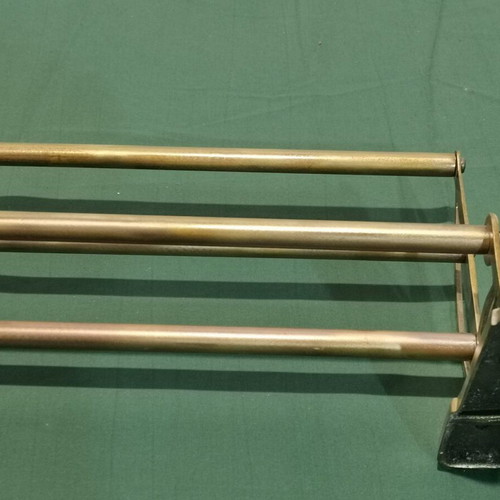 Brass wall-mounted hanger used