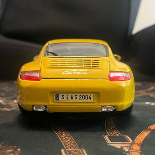 Porsche Carrera yellow 1:18 like new with hazy front windshield