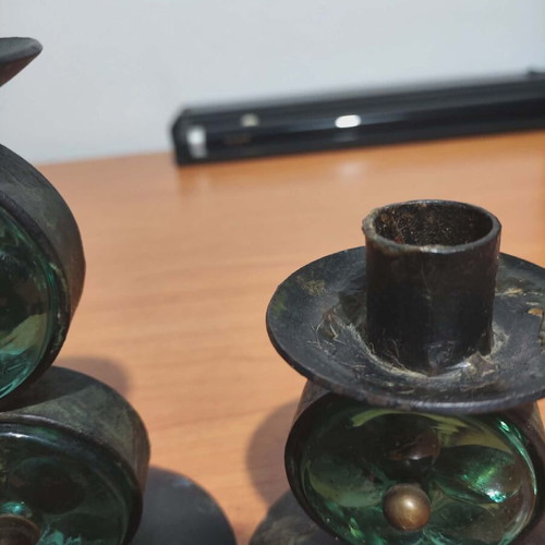 Old candle holders used, metal and glass