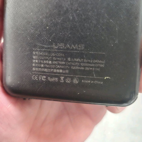 USAMS Power Bank 10,000mAh used with digital display and built-in cables