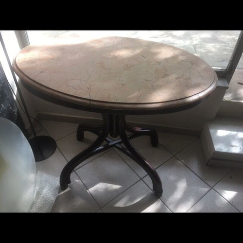 Vintage table with bent wood and oval salmon-pink marble used