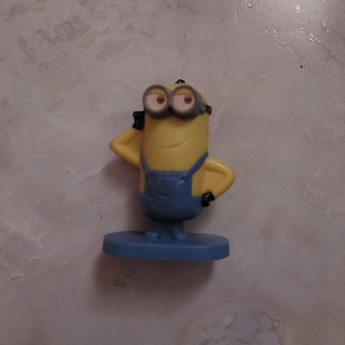Minion figure with rotating base like new