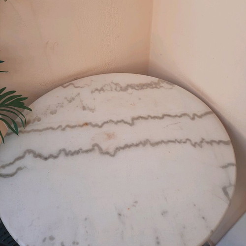 Round café-style table with marble top and cast iron base