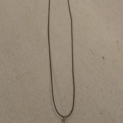 Handmade metal pendant with silver clasp and synthetic silk cord like new