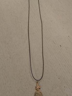 Handmade metal pendant with silver clasp and synthetic silk cord like new