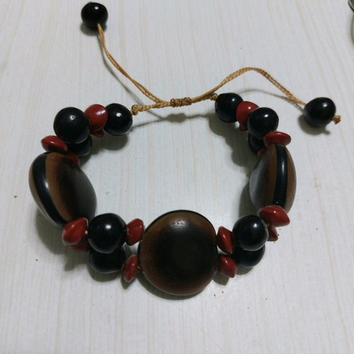 Wooden bracelet like new made from coconut with adjustable cord