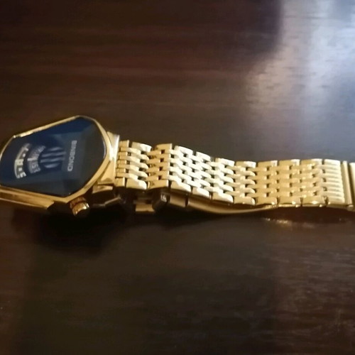 Binbond men's watch like new, gold color bracelet