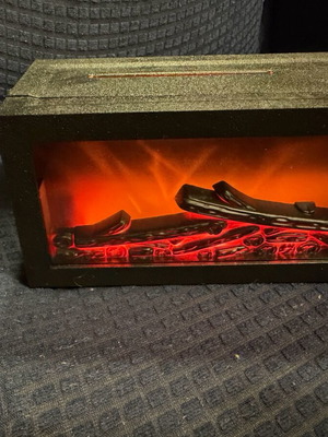 Plug-in room fragrance like new in fireplace shape